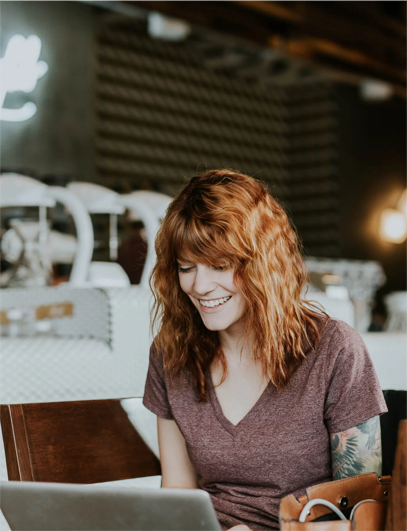 Woman working on her biography from a coffee shop